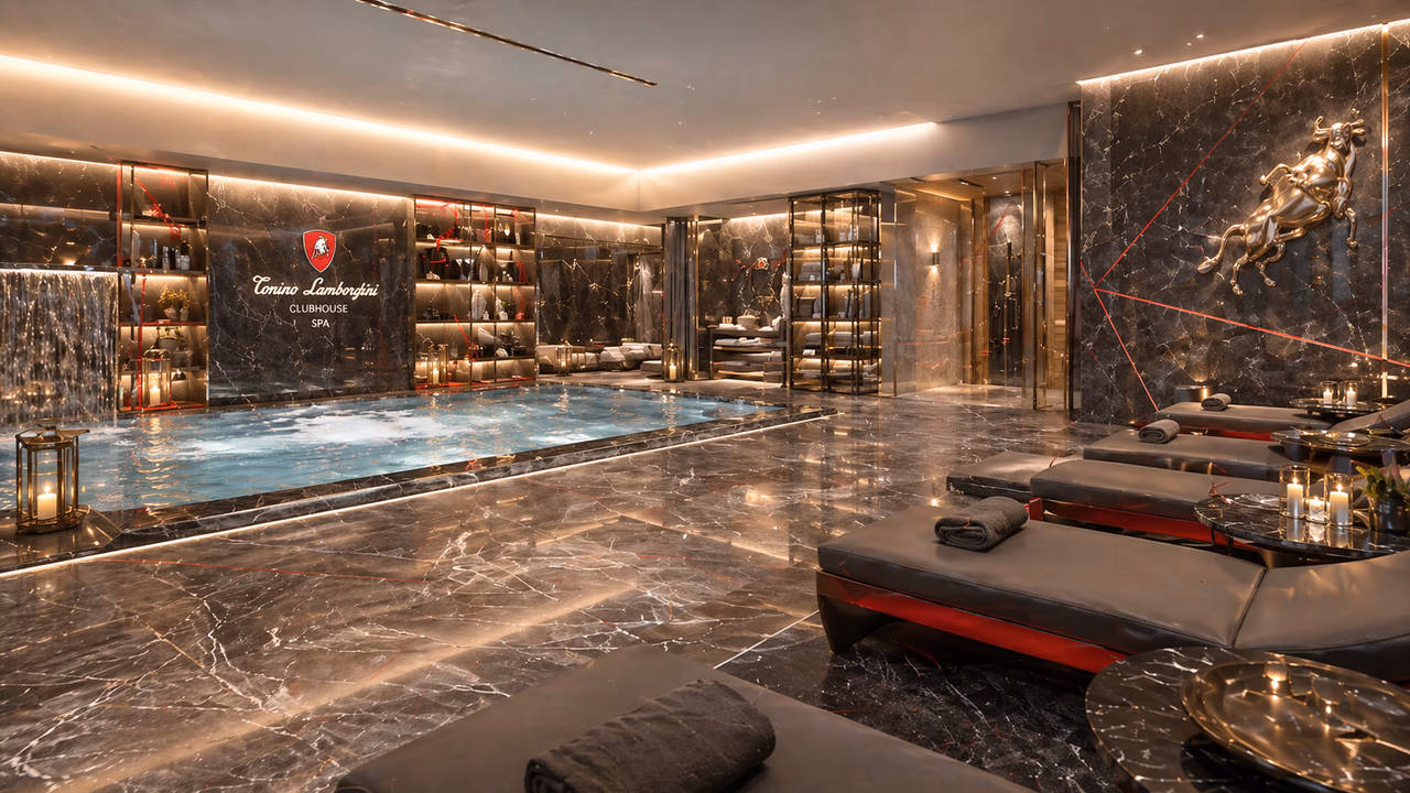 The Tonino Lamborghini Clubhouse Spa — black-veined marble walls, a recessed plunge pool, illuminated wine displays, and a row of staff-attended massage beds.